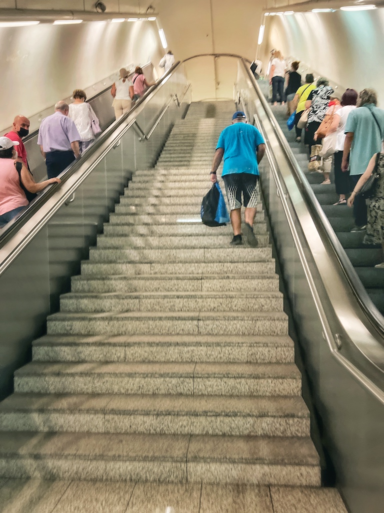 Elderly gentleman climbing stairs